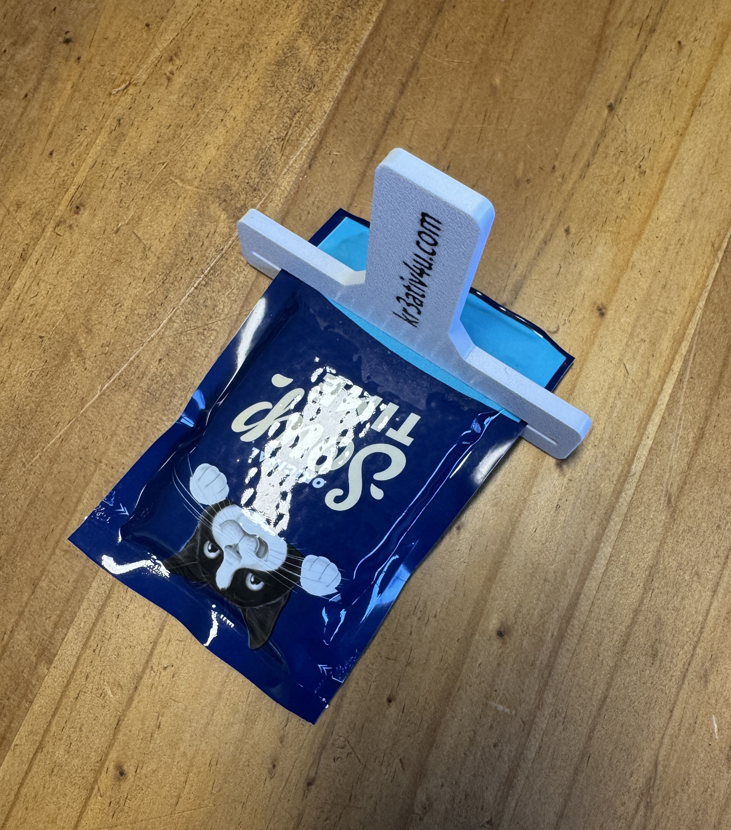 Tütenausquetscher, Cat-Bag Squeezer
